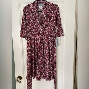 Karina brand floral dress. Three quartered length sleeves. Elastic waist.